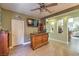 Wet bar with granite countertop, wooden cabinets, and wine storage at 1590 Sabatini Dr, Henderson, NV 89052