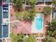 Aerial view of a pool and the nearby homes and cars in the community at 3023 Sunset Harbor Ct, North Las Vegas, NV 89031