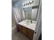 Bathroom featuring a single sink vanity, full mirror, and shower-tub combo at 3023 Sunset Harbor Ct, North Las Vegas, NV 89031