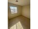 Bedroom with a large window and tan carpet at 3023 Sunset Harbor Ct, North Las Vegas, NV 89031