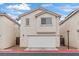 Charming two-story home with a well-maintained front yard and attached garage at 3023 Sunset Harbor Ct, North Las Vegas, NV 89031