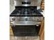 Close-up of a stainless steel gas range in a kitchen setting at 3023 Sunset Harbor Ct, North Las Vegas, NV 89031