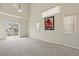 A bright living room with a sliding glass door for backyard access at 3023 Sunset Harbor Ct, North Las Vegas, NV 89031