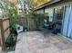 Charming outdoor patio with mature greenery, tile flooring and cozy seating at 3077 Pinehurst Dr # A, Las Vegas, NV 89109