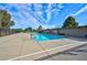 Inviting community pool with surrounding patio and tennis courts in the background at 3768 Territory St, Las Vegas, NV 89121