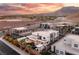 Modern homes community with mountain views at sunset at 4024 Desert Trace Ct, Las Vegas, NV 89129