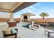 Modern backyard oasis with pool and seating at 4024 Desert Trace Ct, Las Vegas, NV 89129