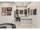 Wet bar with quartz countertop and wine refrigerator at 4024 Desert Trace Ct, Las Vegas, NV 89129