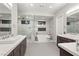 Luxurious bathroom with double sinks, soaking tub, and glass shower at 4024 Desert Trace Ct, Las Vegas, NV 89129