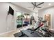 Well-equipped home gym with pool view at 4024 Desert Trace Ct, Las Vegas, NV 89129