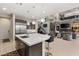 Modern kitchen with large island, stainless steel appliances, and custom cabinetry at 4024 Desert Trace Ct, Las Vegas, NV 89129