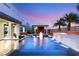 Luxury pool with waterfall features and fire pit at 4024 Desert Trace Ct, Las Vegas, NV 89129