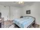 Spacious bedroom with ceiling fan and light wood flooring at 5751 E Hacienda Ave # 107, Las Vegas, NV 89122