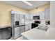 Modern kitchen with stainless steel appliances and light cabinets at 5751 E Hacienda Ave # 107, Las Vegas, NV 89122