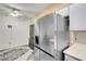 Kitchen features stainless steel appliances and a large refrigerator at 5751 E Hacienda Ave # 107, Las Vegas, NV 89122