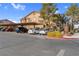 Community parking lot with covered carport spaces at 5751 E Hacienda Ave # 107, Las Vegas, NV 89122