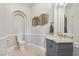 Powder room featuring designer sink, modern light fixture and neutral colors at 1529 Villa Rica Dr, Henderson, NV 89052