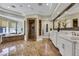 Elegant bathroom with marble floors, soaking tub, dual sinks, and glass enclosed shower at 1529 Villa Rica Dr, Henderson, NV 89052