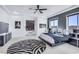 Modern bedroom with a black and white zebra rug, dark trim, and bright sunlight at 1529 Villa Rica Dr, Henderson, NV 89052