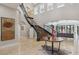 Elegant entryway with a grand staircase and marble floors adds a touch of luxury to welcome guests at 1529 Villa Rica Dr, Henderson, NV 89052