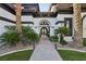 Elegant entryway with double doors and landscaping at 1529 Villa Rica Dr, Henderson, NV 89052