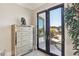 Entryway with mirrored dresser and view of the backyard and pool at 1529 Villa Rica Dr, Henderson, NV 89052