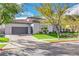 Luxury home with a driveway and manicured lawn at 1529 Villa Rica Dr, Henderson, NV 89052