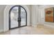 Elegant foyer with decorative glass double doors and tile flooring at 1529 Villa Rica Dr, Henderson, NV 89052