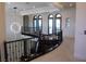 Elegant hallway features wrought iron railings, high ceilings, and sophisticated lighting at 1529 Villa Rica Dr, Henderson, NV 89052