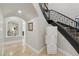 Hallway with curved staircase and gallery at 1529 Villa Rica Dr, Henderson, NV 89052