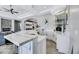 Stylish kitchen area with sleek counters, white cabinetry, and bar seating at 1529 Villa Rica Dr, Henderson, NV 89052