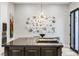 View of the kitchen island, modern lighting, and stainless built in microwave and oven at 1529 Villa Rica Dr, Henderson, NV 89052