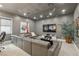 Cozy living room with gray walls, comfortable seating, a large TV, and a houseplant at 1529 Villa Rica Dr, Henderson, NV 89052