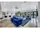 Expansive living room with bar, plush seating, and water views at 1529 Villa Rica Dr, Henderson, NV 89052