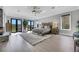 Sunlit main bedroom with a fireplace, patio access, and a comfortable seating area at 1529 Villa Rica Dr, Henderson, NV 89052