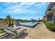 Inviting backyard featuring a pool, lounge chairs, and a beautifully landscaped area at 1529 Villa Rica Dr, Henderson, NV 89052