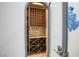 Wine cellar with decorative shelving and adjacent to frosted glass door at 1529 Villa Rica Dr, Henderson, NV 89052