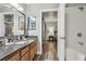 Bathroom featuring a granite vanity top, wood cabinets, and shower and tub combo at 3145 E Flamingo Rd # 1045, Las Vegas, NV 89121