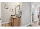 Bright bathroom with a granite countertop vanity and decorative wall art at 3145 E Flamingo Rd # 1045, Las Vegas, NV 89121