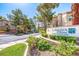 The attractive entrance to Laguna Palms Condominiums with lush landscaping at 3145 E Flamingo Rd # 1045, Las Vegas, NV 89121