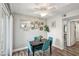 Small dining area with teal chairs and a black table, near kitchen at 3145 E Flamingo Rd # 1045, Las Vegas, NV 89121