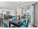 View of the dining area open to the living room, with a sliding glass door to the outside at 3145 E Flamingo Rd # 1045, Las Vegas, NV 89121