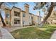 Charming two-story exterior showing the building's architecture and manicured landscaping at 3145 E Flamingo Rd # 1045, Las Vegas, NV 89121