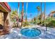 Relaxing outdoor hot tub area with stone accents and tropical landscaping at 3145 E Flamingo Rd # 1045, Las Vegas, NV 89121