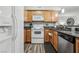 Well-equipped kitchen featuring wood cabinets and granite countertops at 3145 E Flamingo Rd # 1045, Las Vegas, NV 89121