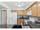 Kitchen with white appliances and granite countertops at 3145 E Flamingo Rd # 1045, Las Vegas, NV 89121