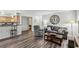 Inviting living room with a gray couch, clock decor, and modern flooring at 3145 E Flamingo Rd # 1045, Las Vegas, NV 89121