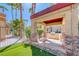 Outdoor kitchen with stone accents and green space is perfect for entertaining at 3145 E Flamingo Rd # 1045, Las Vegas, NV 89121