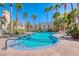 Inviting community pool surrounded by lush landscaping and palm trees, perfect for relaxation and recreation at 3145 E Flamingo Rd # 1045, Las Vegas, NV 89121