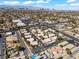 Aerial view of community with city skyline, landscaping, and nearby shopping at 3425 E Russell Rd # 240, Las Vegas, NV 89120